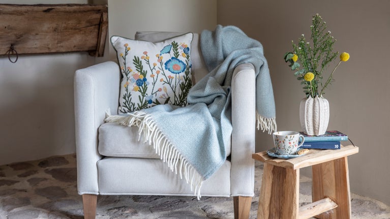A floral cushion and throw - part of the spring collection 2025
